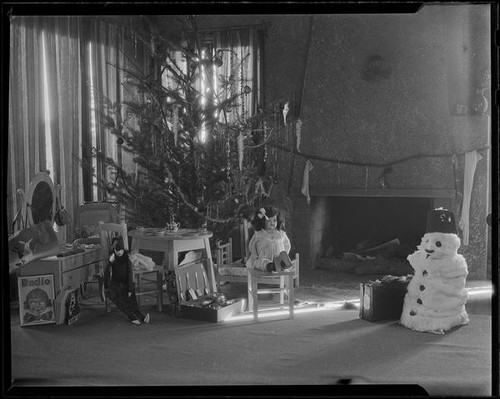 Christmas tree, fireplace, toys, and cotton snowman, Santa Monica, 1925