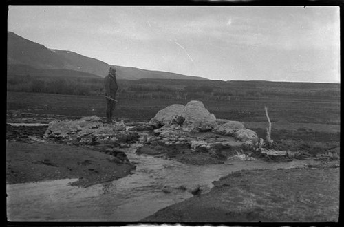 Man standing on tufa, Mono County, [1929?]