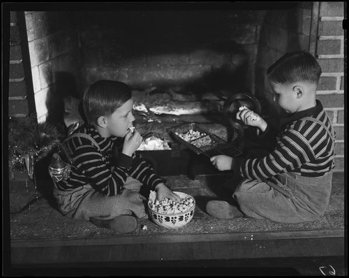 Boys at fireplace with popcorn, Los Angeles, circa 1935