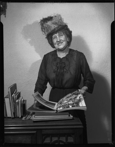 Lucille S. King, actress and ventriloquist, dressed as a Victorian, 1951