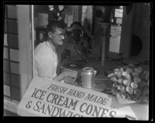 Jack Halstein at his concession, Jacks Famous Ice Cream Cones, on Abbot Kinney Pier, Venice, 1928