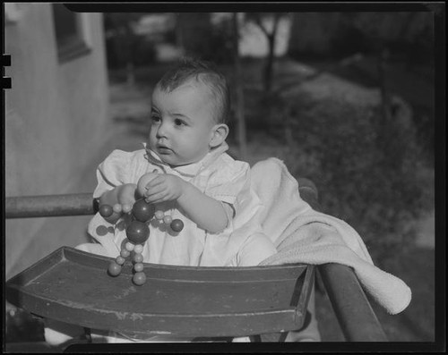 Baby in highchair, Los Angeles, 1935