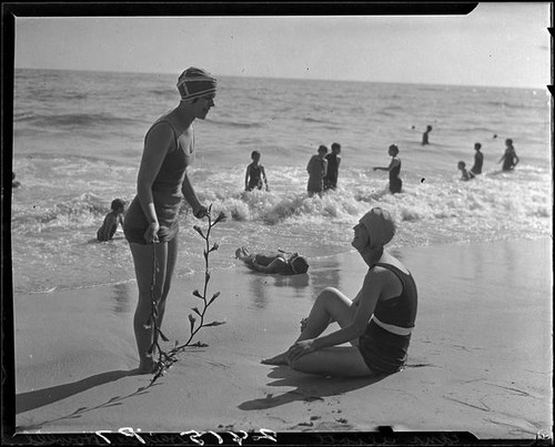 Edna Elliott and Daisey Howell on beach with seaweed, Pacific Palisades, 1927