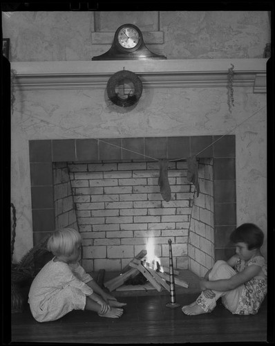 Girls in pajamas at fireplace, Los Angeles, circa 1935