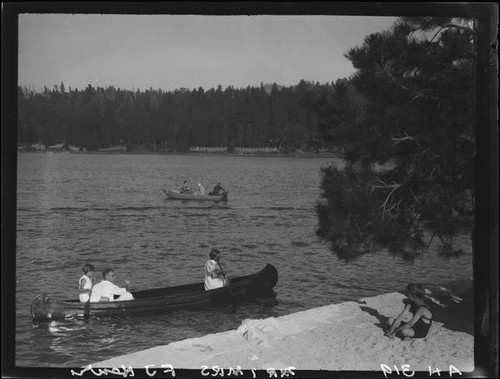 Canoe and rowboat on lake, Lake Arrowhead, 1929