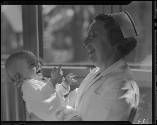 Baby and nurse, Los Angeles, circa 1935