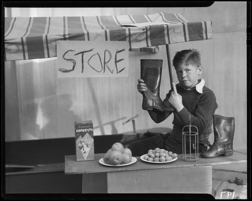 Boy playing store, Los Angeles, circa 1935