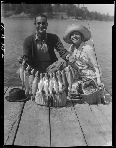 Actors Rod La Rocque and Vilma Banky with fish, Lake Arrowhead, 1929