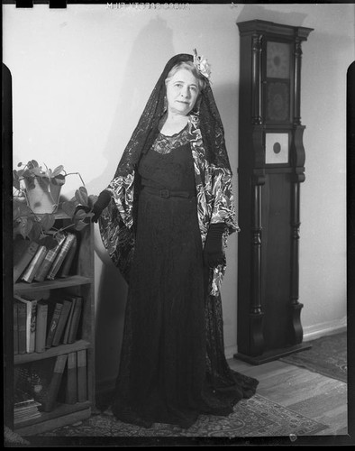 Mrs. Flournoy, in lace head scarf and lace dress, [1950s?]