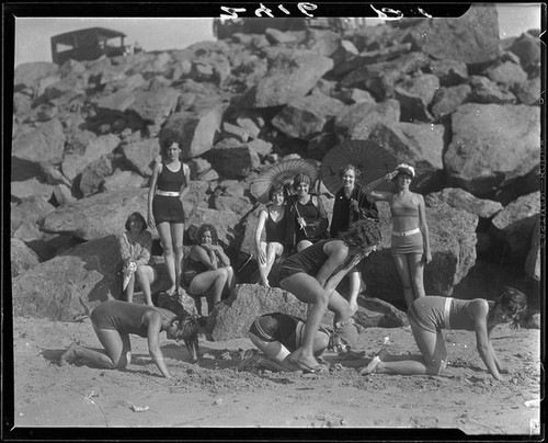 Young women on beach playing leapfrog, Pacific Palisades, 1928