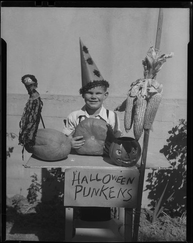 Boy at table with Halloween decorations, Los Angeles, circa 1935