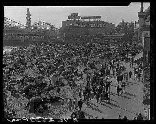 Bird's-eye view of crowded beach, Lick Pier, and Ocean Park Pier, Venice and Santa Monica, 1928