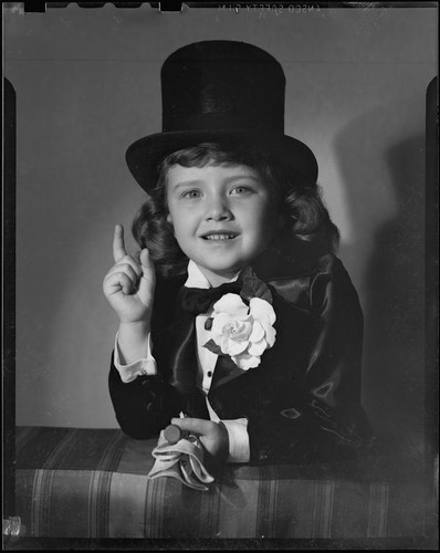 Helena Burnett in tuxedo costume and top hat, 1947-1950