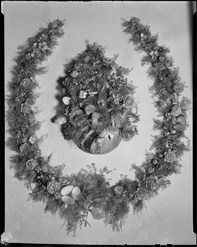 Horseshoe-shaped shell art wreath made in 1888 by poet Ina Donna Coolbrith, Santa Monica, 1940