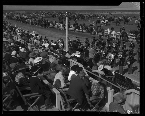 Horseback riders and band at Desert Circus Rodeo on parade grounds at Palm Springs Field Club, Palm Springs, 1938