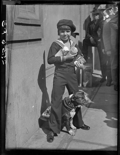 Child actor Jackie Coogan with cans of condensed milk, [1924]