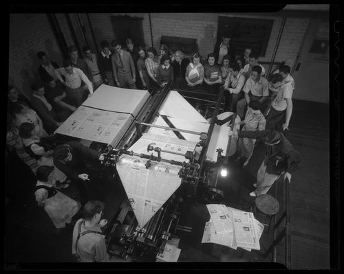 Students watching printing press at Los Angeles City College, Los Angeles, circa 1933-1938