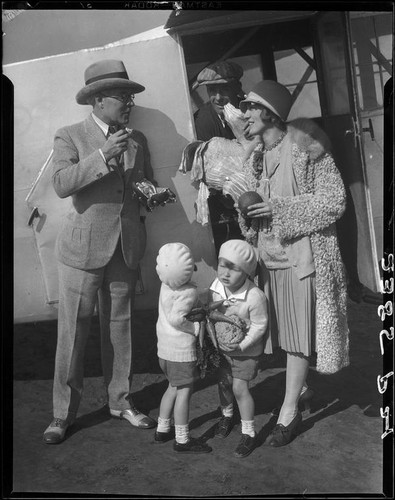 Dr. St. Louis Albert and Esther Estes with two children next to a trailer, between 1928 and 1936