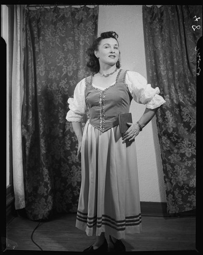 Mezzo soprano June Moss in a dirndl costume for the opera Martha, Santa Monica, circa 1956