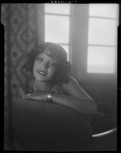 Woman looking over back of chair at the Hotel Playa de Ensenada, Ensenada, 1931