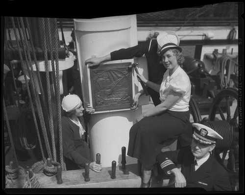 Alice Carter nailing plaque to mast, S.S. Constitution, San Diego Harbor, San Diego, 1934