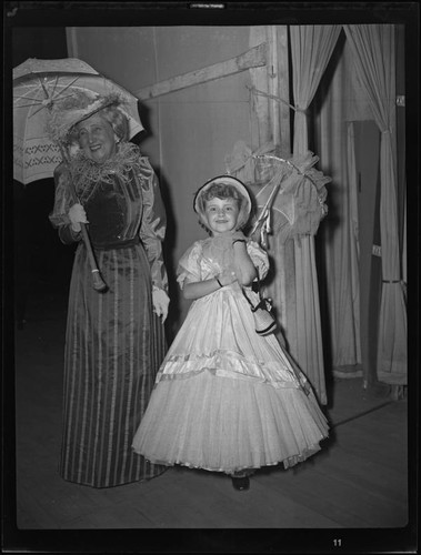 Lucille S. King, actress and ventriloquiest, with child actress, 1951