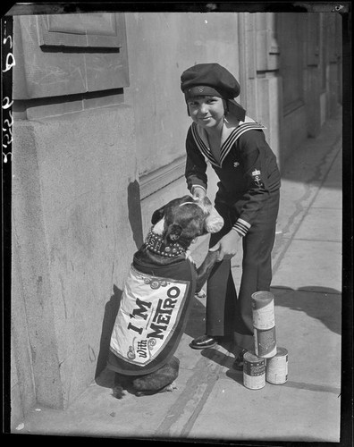 Child actor Jackie Coogan with cans of condensed milk, [1924]