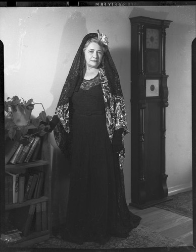 Mrs. Flournoy, in lace head scarf and lace dress, [1950s?]