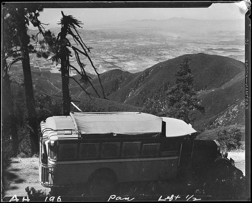 Bus on road overlooking San Bernardino Valley, near Lake Arrowhead, 1929