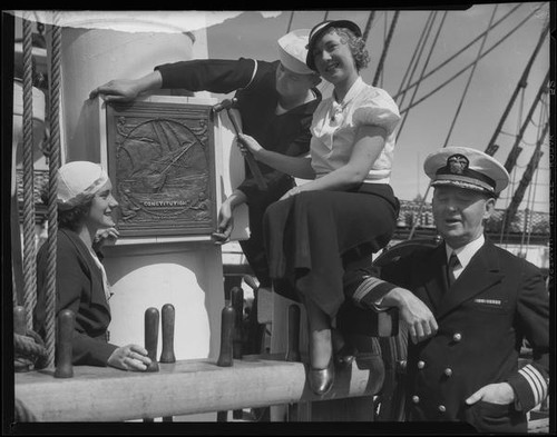 Alice Carter nailing plaque to mast, S.S. Constitution, San Diego Harbor, San Diego, 1934