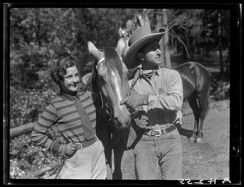 Sally Phipps, unidentified man, and horses, Lake Arrowhead, 1929