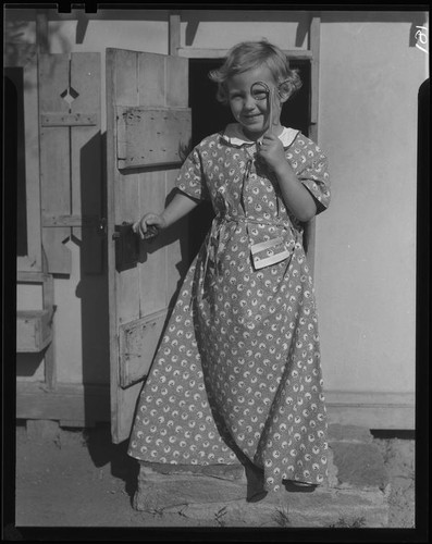 Girl at door of playhouse, Los Angeles, circa 1935