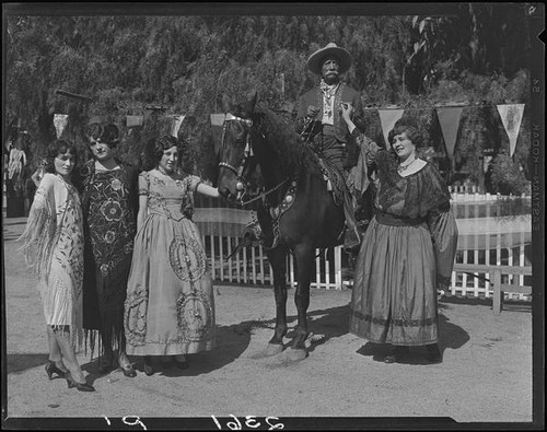 Eugene R. Plummer, on horseback, with 4 women, Hollywood, 1931