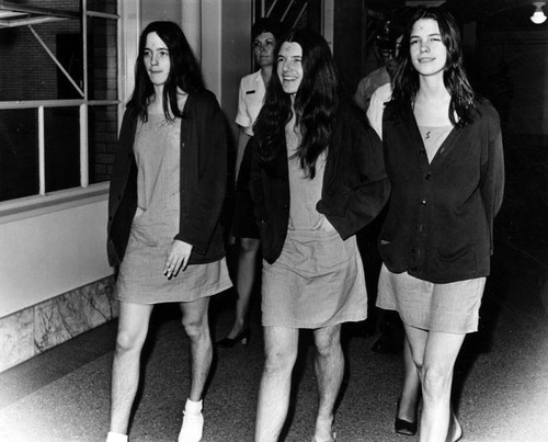 Three Manson followers during murder trial