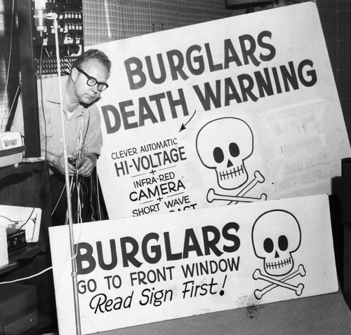 Windows signs warn burglars — Calisphere