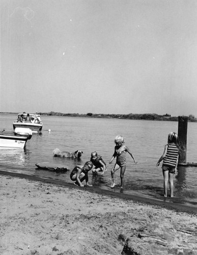 Girls and their dog at the beach