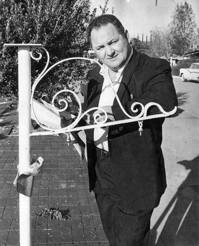 Richard Moss inspects bomb damage