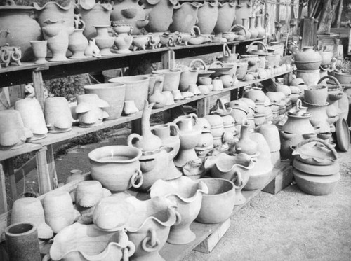 Shelves of pottery at La Bonita Factory