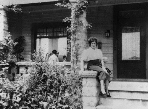 Mexican American woman on porch