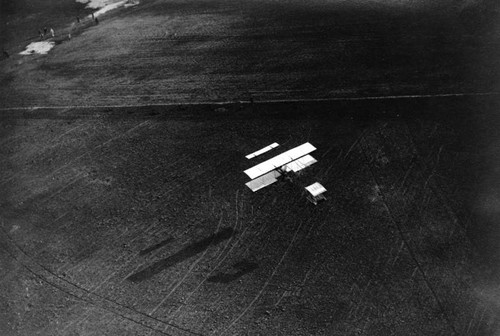 Another aerial view of a biplane in flight