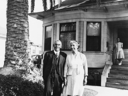 Couple outside a house