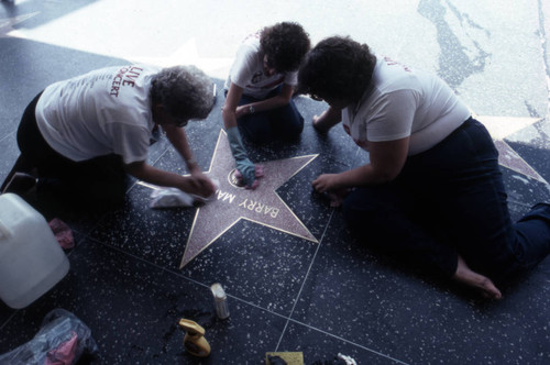 Cleaning a Walk of Fame star