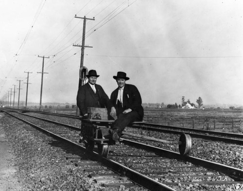 Two men on a handcar