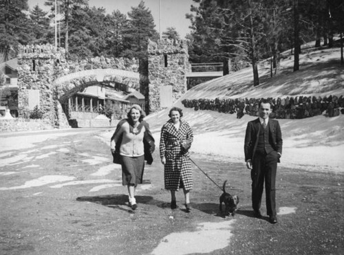 Ethel Schultheis walks a dog with friends