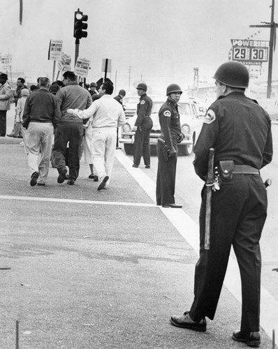 Helmeted officers keep peace at Lockheed