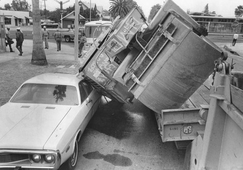 Roller falls on car