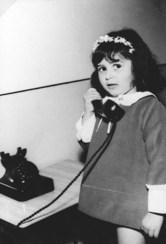 Iranian American girl on telephone