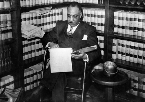 Walter Gordon, Jr. reviewing a case