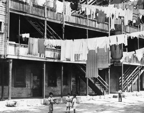 Children playing near slum apartments