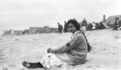 Woman sitting on the beach